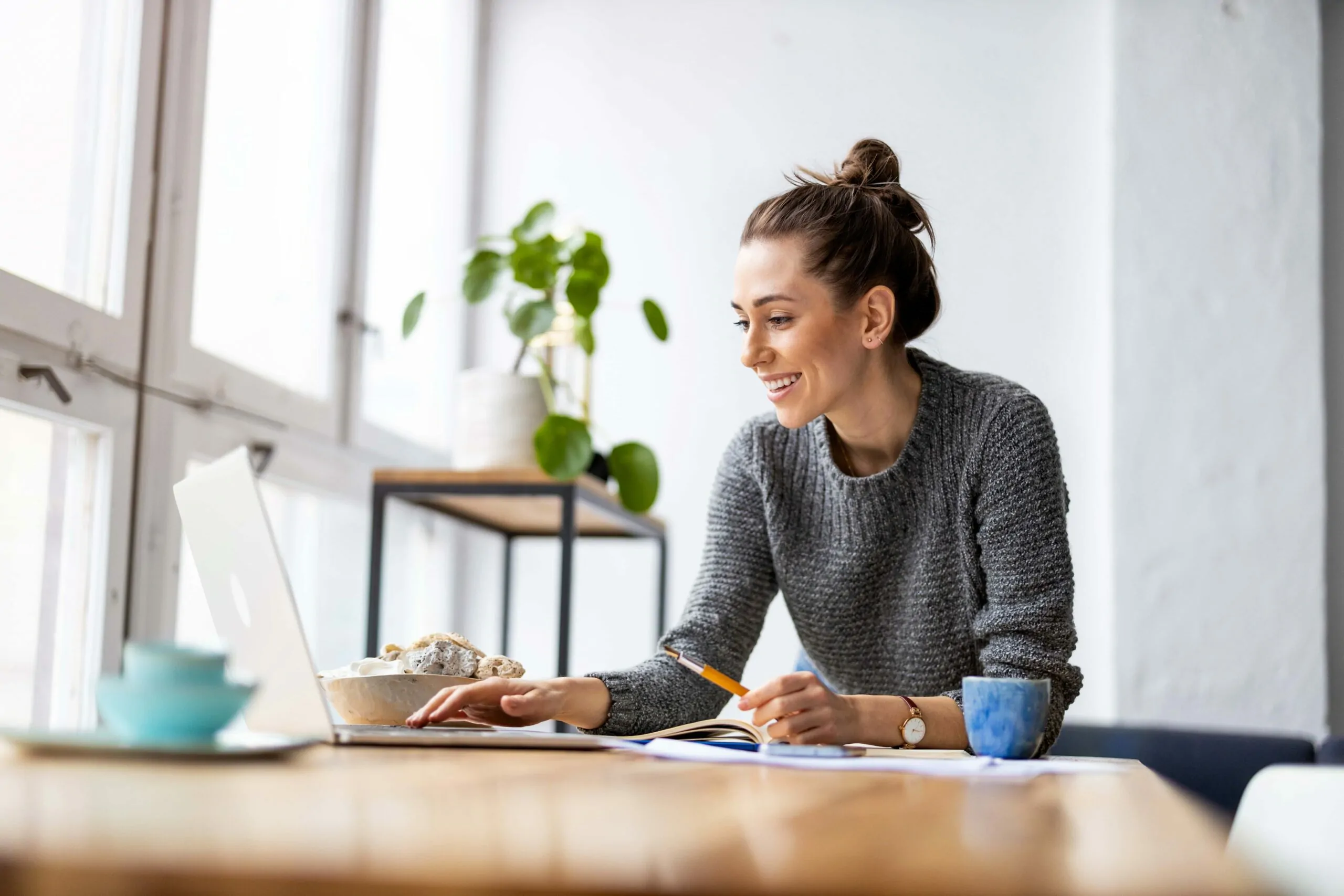 A woman sitting at a laptop