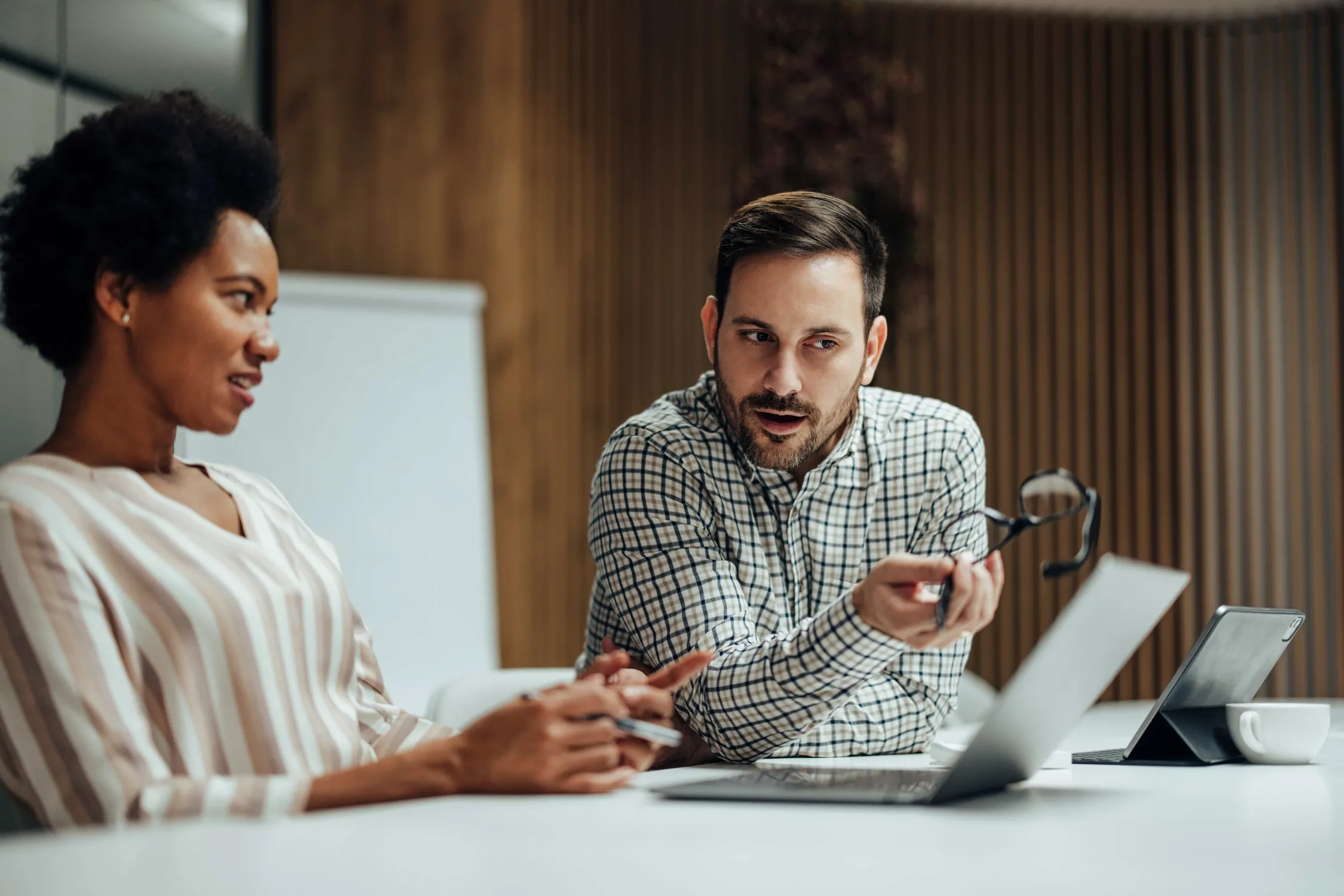 two team members discussing source-to-pay trends and predictions
