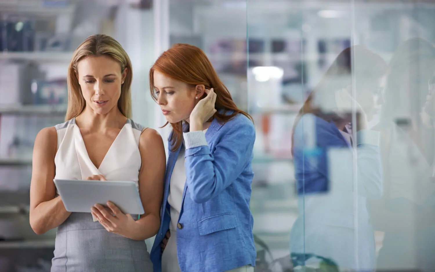 two women discussing how to manage audits effectively through a crisis